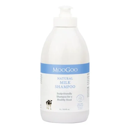 White MooGoo Natural Milk Shampoo bottle with blue label and pump top; scalp-friendly shampoo for a healthy head (1L).