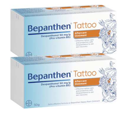 Bepanthen Tattoo aftercare ointment boxes with blue gradient and floral artwork, indicating dexpanthenol 50 mg/g for skin recovery