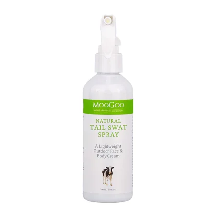 White MooGoo Tail Swat Spray bottle with a green label, a lightweight outdoor face and body cream for dogs (dog illustration on label).