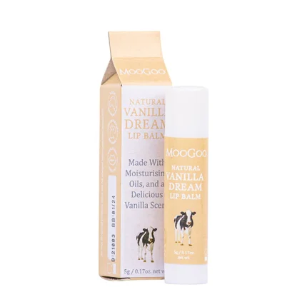 Lip balm tube and matching box for MooGoo Natural Vanilla Dream Lip Balm; gold label with a cow illustration, vanilla scent, white cap, beige packaging.
