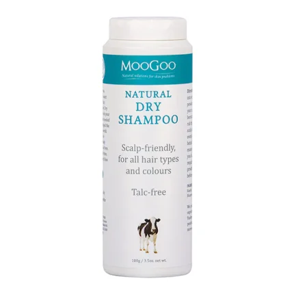 MooGoo Natural Dry Shampoo bottle with teal label; scalp-friendly, talc-free, designed for all hair types and colours, small dog image at base.