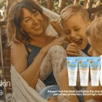 Hamilton skincare banner showing a smiling woman with a child outdoors next to a row of sunscreen products; slogans read “sunday fundays” and “where your skin feels at home.”