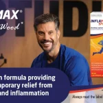 Smiling man in blue scrubs beside Inflamax spray packaging with bold ad text about high-strength relief from muscle pain and inflammation.