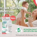 Happy family holding a baby with Pigeon SofTouch bottles on display and the slogan 'Together, we nurture their tomorrow'.